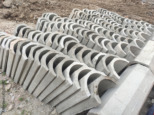 SEREMBAN, MALAYSIA -AUGUST 28, MALAYSIA: U shape precast drain at the construction site. Built of reinforced concrete. These materials are collected and stacked on top of each other before installing.