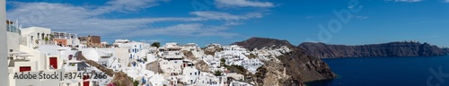 Village of Oía island of Santorini, Greece. Coast line popular white houses