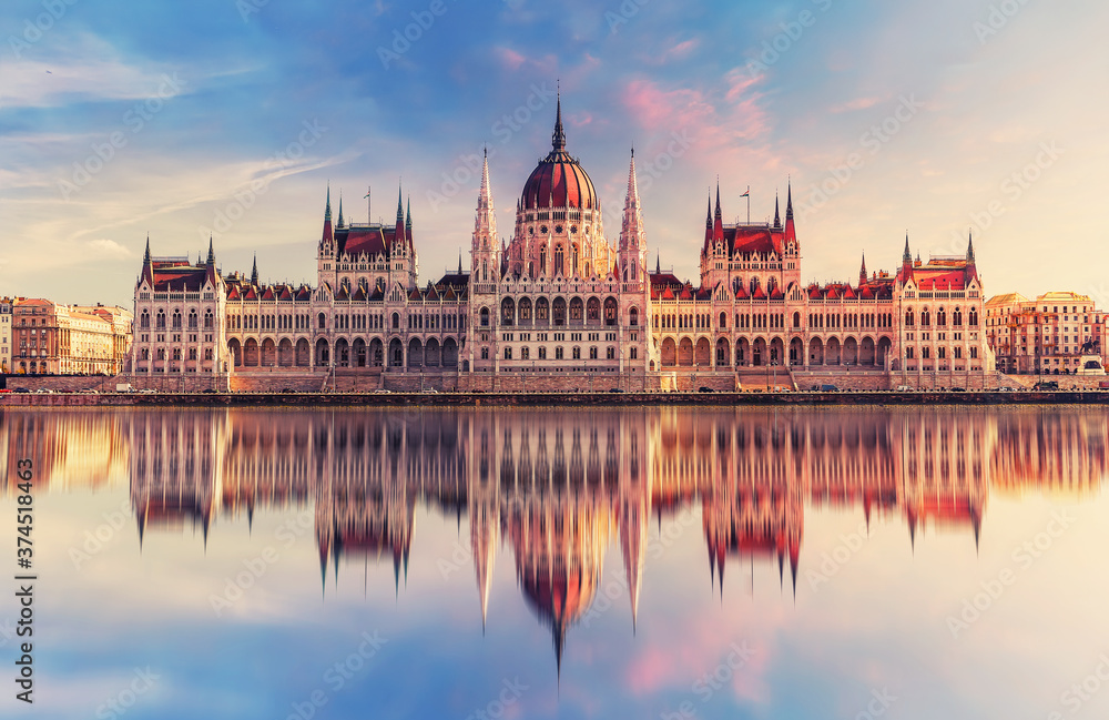 Obraz premium Incredible front view on Parliament building in Budapest with fantastic perfect sky and reflection in water. calm Danube river. Popular Travel destinations. creative image used as background.