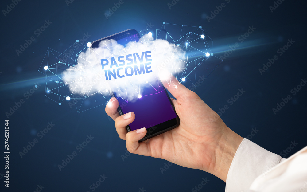 Female hand touching smartphone with PASSIVE INCOME inscription, cloud business concept Female hand touching smartphone with PASSIVE INCOME inscription, cloud business concept