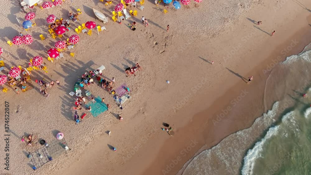 Colourful sea beach on a hot summer day, aerial drone view 4k slow motion Colourful sea beach on a hot summer day, aerial drone view 4k slow motion