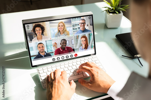 Businessman videoconferencing with doctor on laptop