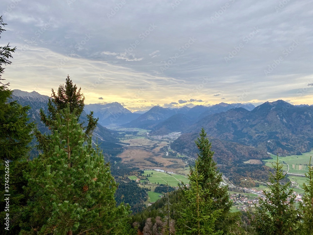 Mountain view over valley with clouds during sunset, alps, Bavaria, Germany Mountain view over valley with clouds during sunset, alps, Bavaria, Germany