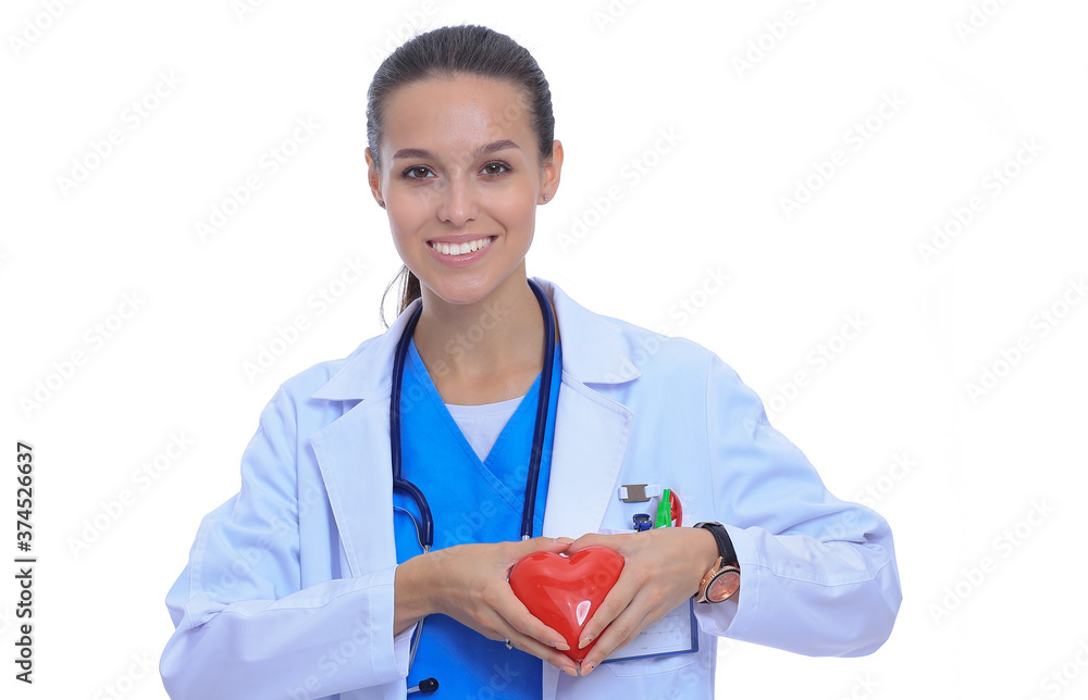 Positive female doctor standing with stethoscope and red heart symbol isolated. Woman doctor Positive female doctor standing with stethoscope and red heart symbol isolated. Woman doctor