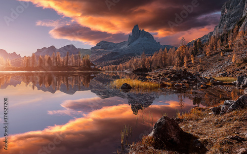 Fantastic colorful scenery in mountains during sunset. Fabulous landscape over calm mountain lake Federa in the summer morning, picture of Wild area. Stunning Natural Background. Creative image