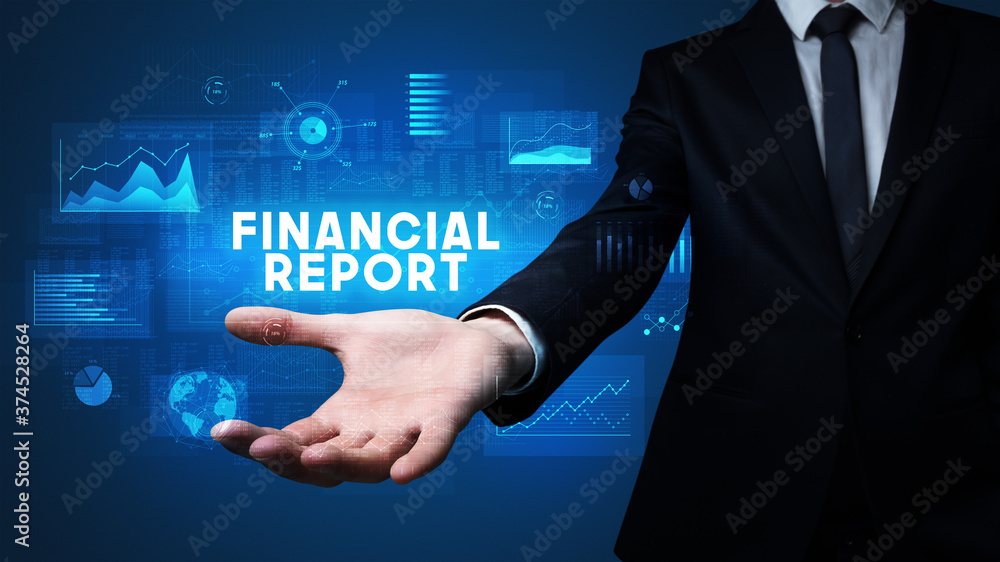 Hand of Businessman holding FINANCIAL REPORT inscription, business success concept Hand of Businessman holding FINANCIAL REPORT inscription, business success concept