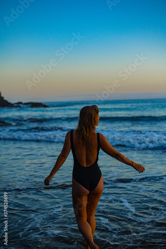 woman in a bikini posing on the beach