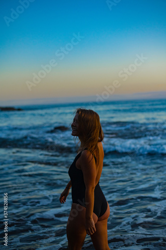 woman in a bikini posing on the beach