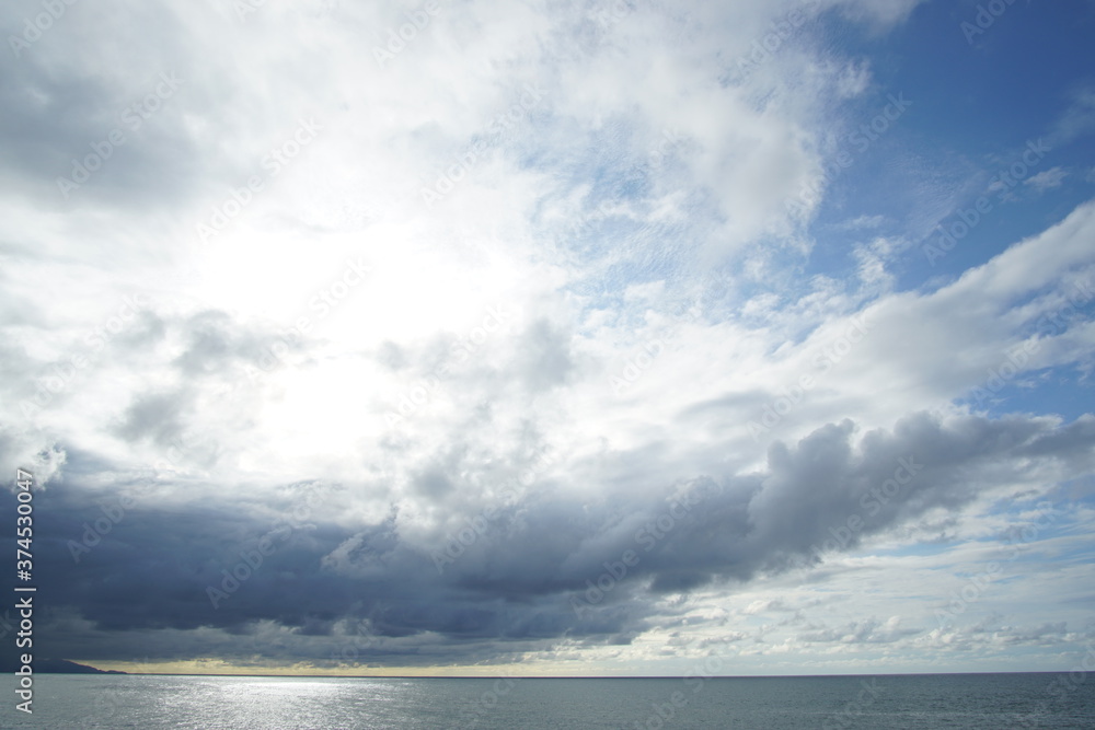 blue sea and cloudy sky over it. Blue Sea sky and Clouds