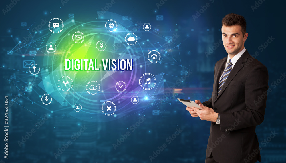 Businessman thinking in front of technology related icons and DIGITAL VISION inscription, modern technology concept Businessman thinking in front of technology related icons and DIGITAL VISION inscription, modern technology concept