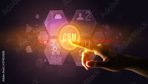 Hand touching CRM inscription, new technology concept