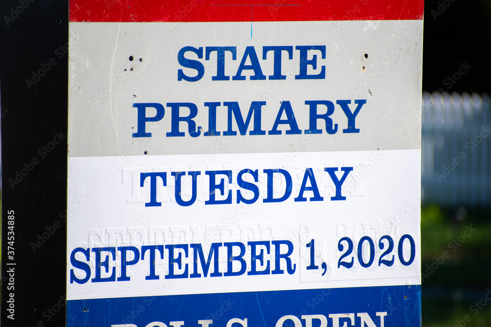 A red and blue metal sign for the September 1st, 2020 State Primary voting ballots.