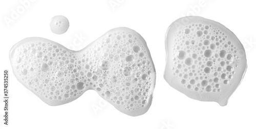 Foto Spilled beer puddle with foam isolated on white background and texture, top view
