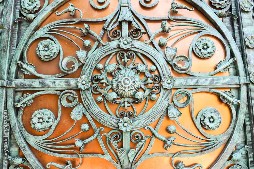 forged metal product. fragments of a forged lattice on the gate forged metal product. fragments of a forged lattice on the gate