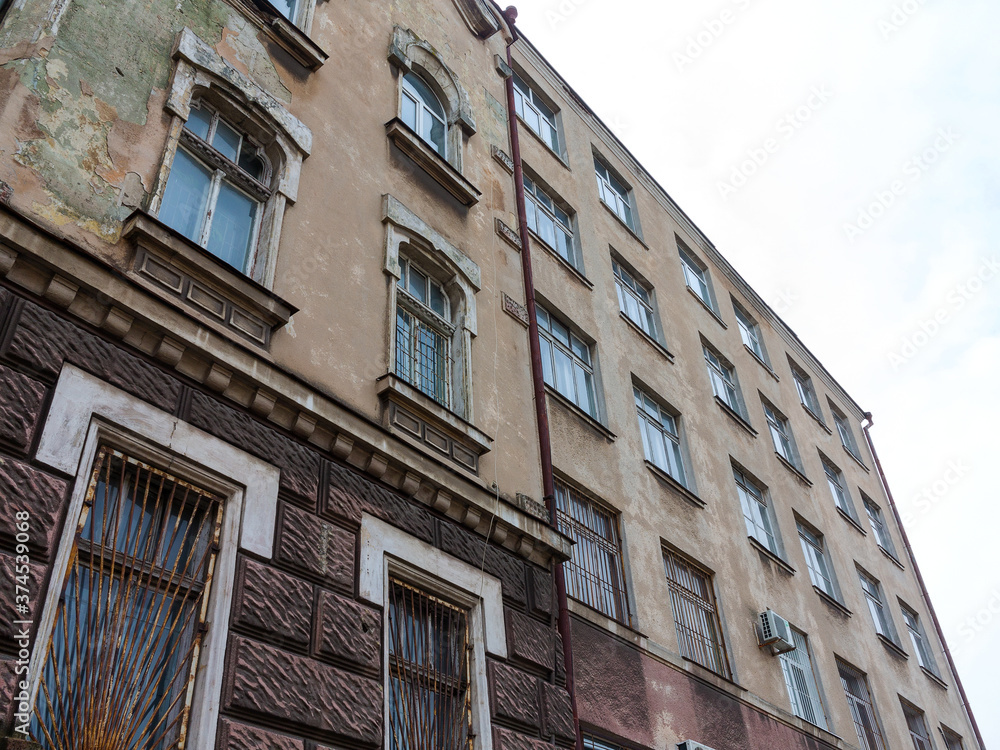 Ancient historical destructible building. Old architecture, broken glass