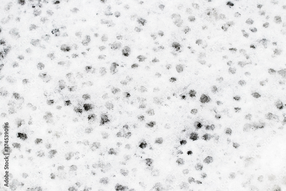 Texture of wet snow with holes from raindrops Texture of wet snow with holes from raindrops