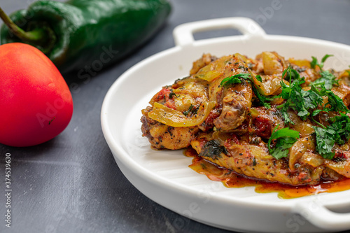 Bilde på lerret Spicy delicious chicken wings cooked with hot sauce and tomato with caramelized