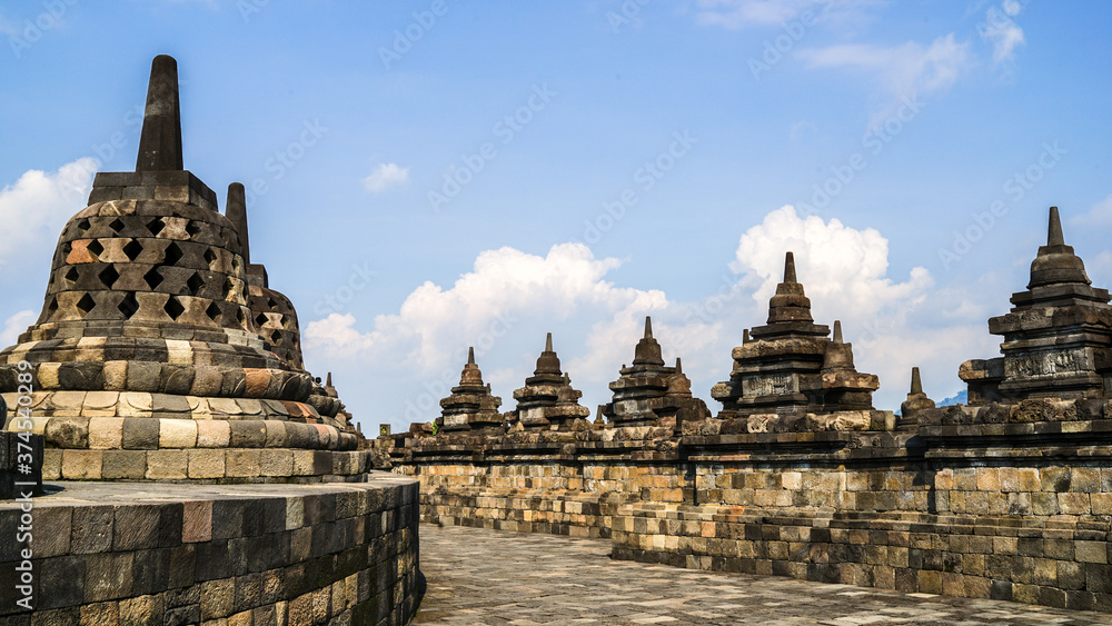 Borobudur Temple in Indonesia, South East Asia, UNESCO World Heritage Site, blue sky and sunny warm weather in summer, best season to visit Indonesia, sightseeing tour