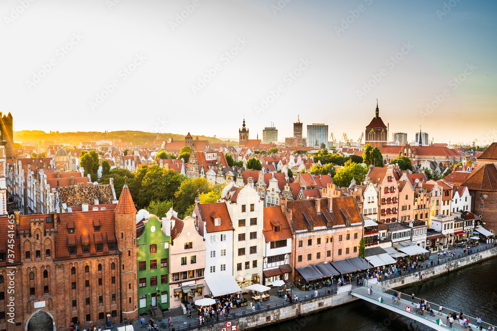 Gdansk, North Poland : Panoramic aerial shot of Motlawa river embankment in Old Town during sunset in summer