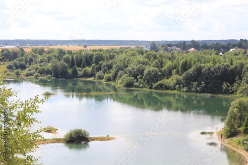 Top view of the lake and green landscape