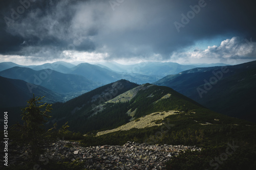 green Mountain in Carpatians Ukraine with storm clouds