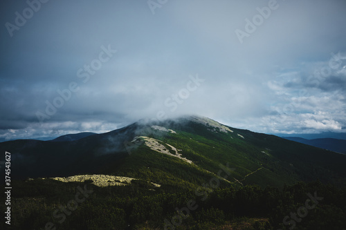 green Mountain in clouds in Carpatians Ukraine