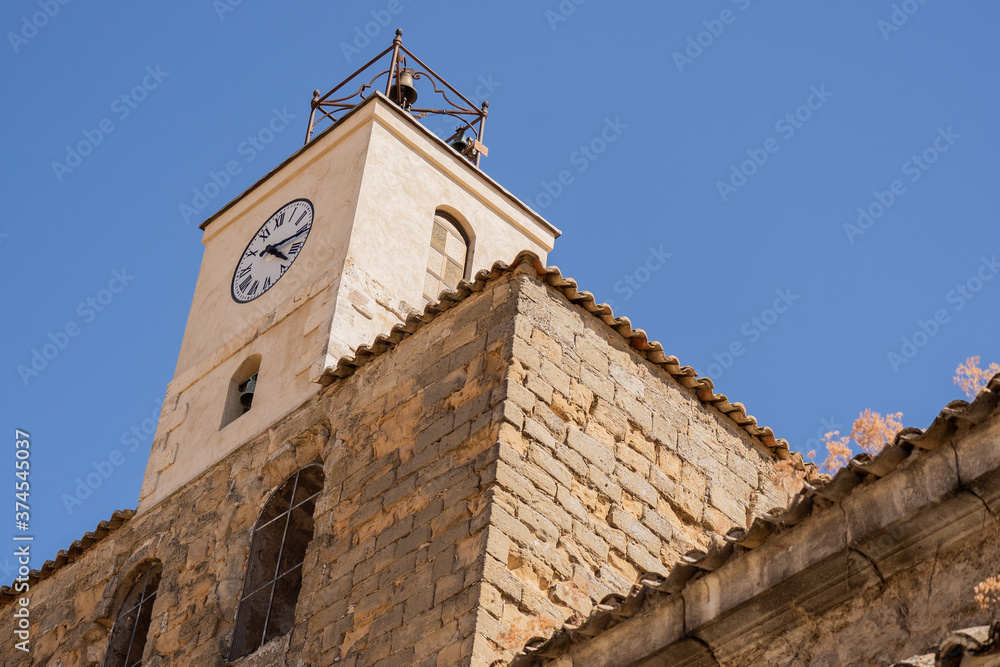 Clock tower of a small church in Cuenca Spain