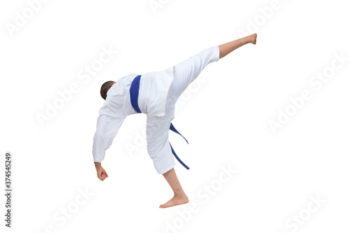 In karategi boy athlete beats kick on white isolated background