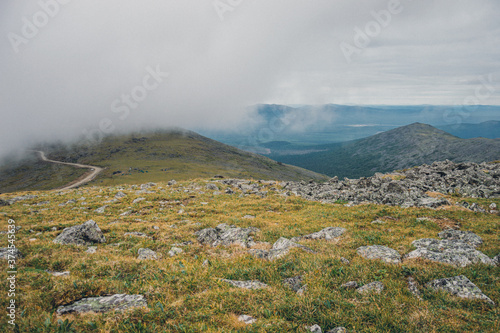 Mountain landscape in the Urals with dense fog photo