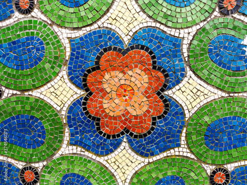 Detail of beautiful old collapsing abstract ceramic mosaic adorned building. Venetian mosaic as decorative background. Selective focus. Abstract Pattern. Abstract mosaic colored ceramic stones