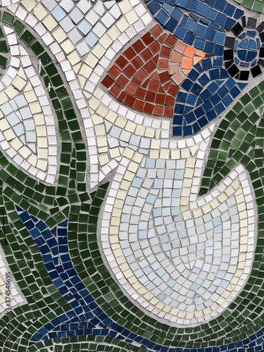 Detail of beautiful old collapsing abstract ceramic mosaic adorned building. Venetian mosaic as decorative background. Selective focus. Abstract Pattern. Abstract mosaic colored ceramic stones