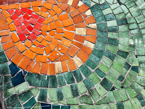Detail of beautiful old collapsing abstract ceramic mosaic adorned building. Venetian mosaic as decorative background. Selective focus. Abstract Pattern. Abstract mosaic colored ceramic stones
