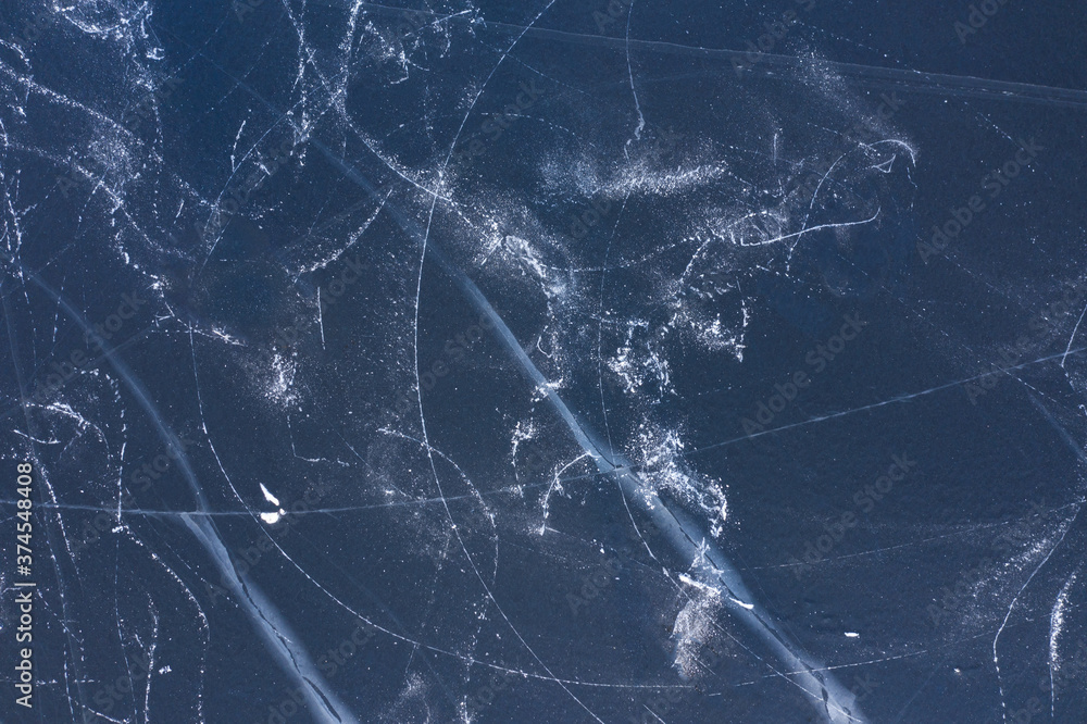 Natural background of a frozen river with patterns from skates. The view from the top. Natural background of a frozen river with patterns from skates. The view from the top.
