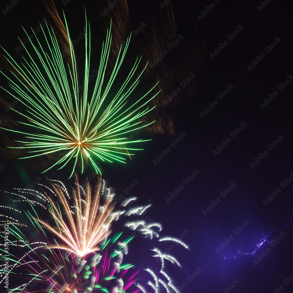 Fireworks in night sky with lightning strike. Fireworks in night sky with lightning strike.