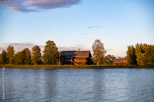 ancient churches on the island at sunset on the background of the lake