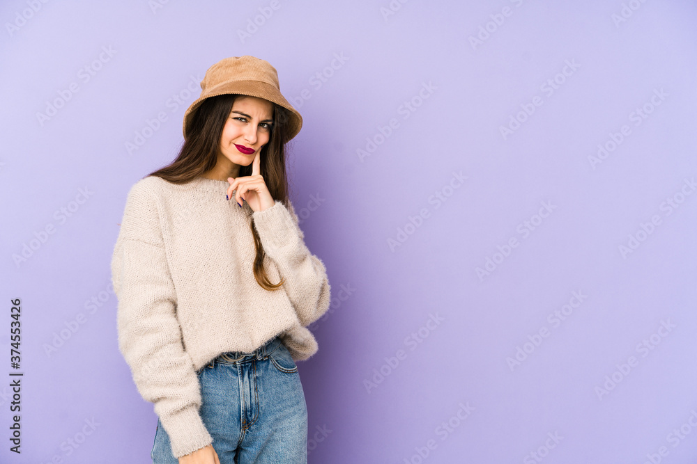 Young caucasian woman isolated on purple background contemplating, planning a strategy, thinking about the way of a business. Young caucasian woman isolated on purple background contemplating, planning a strategy, thinking about the way of a business.