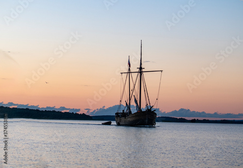 old northern boat on the lake at sunset © константин константи