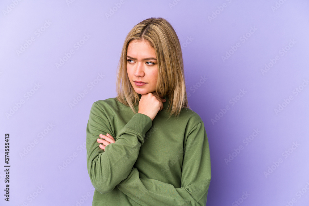 Young blonde caucasian woman isolated suffers pain in throat due a virus or infection. Young blonde caucasian woman isolated suffers pain in throat due a virus or infection.