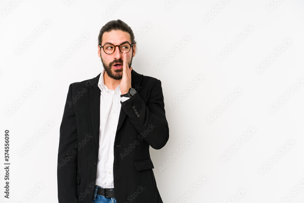 Young caucasian business man isolated on a white background is saying a secret hot braking news and looking aside Young caucasian business man isolated on a white background is saying a secret hot braking news and looking aside