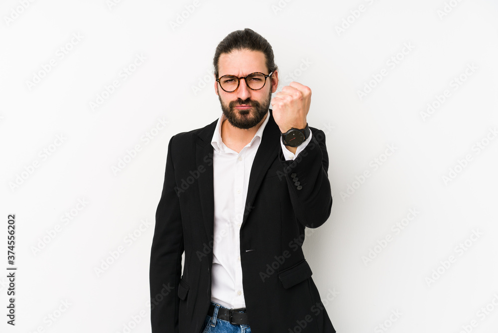 Young caucasian business man isolated on a white background showing fist to camera, aggressive facial expression. Young caucasian business man isolated on a white background showing fist to camera, aggressive facial expression.