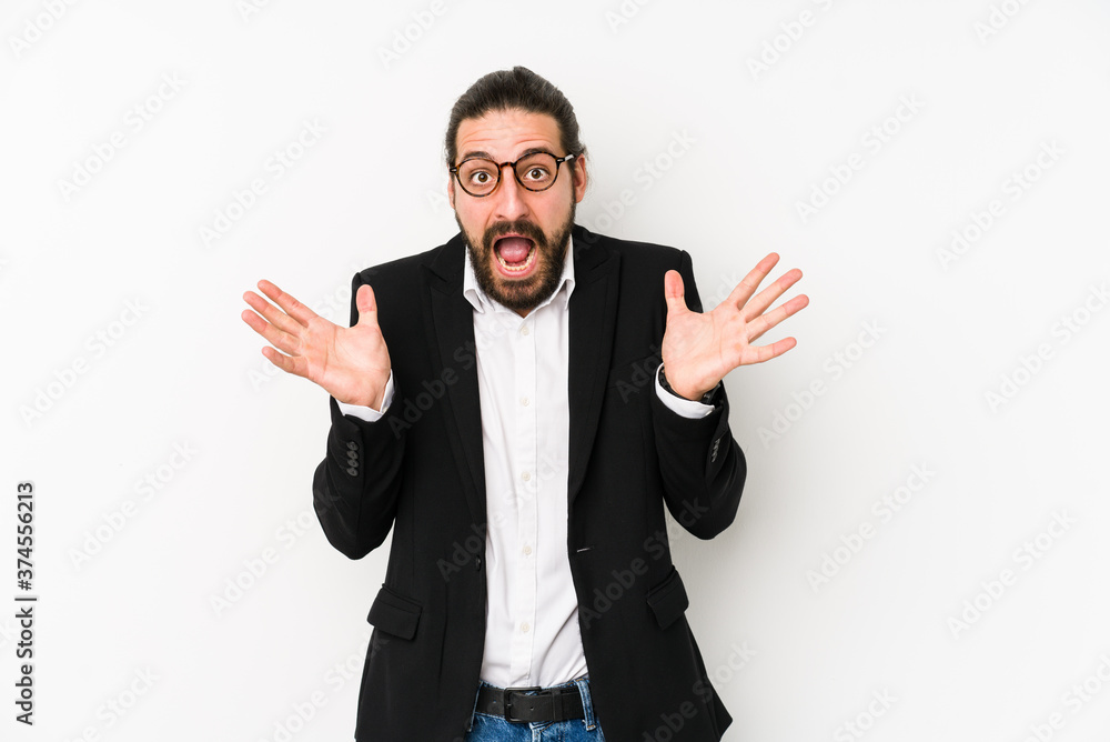 Young caucasian business man isolated on a white background celebrating a victory or success, he is surprised and shocked. Young caucasian business man isolated on a white background celebrating a victory or success, he is surprised and shocked.