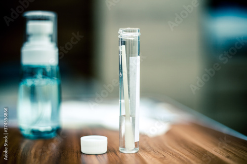 closeup photo of a swab tube from the home Covid-19 test kit