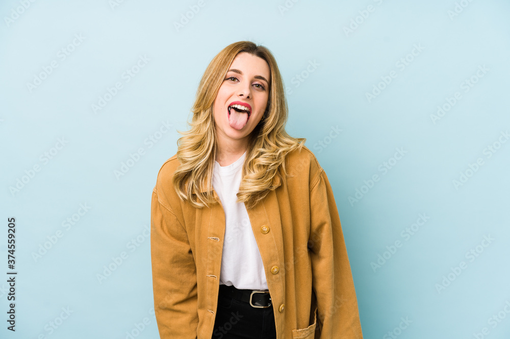 Young blonde pretty woman isolated funny and friendly sticking out tongue. Young blonde pretty woman isolated funny and friendly sticking out tongue.