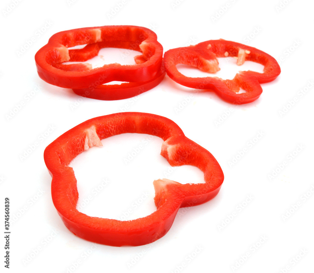 red pepper slices on white background red pepper slices on white background