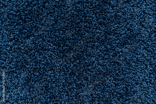 The texture of a blue carpet. Fleecy surface. Background