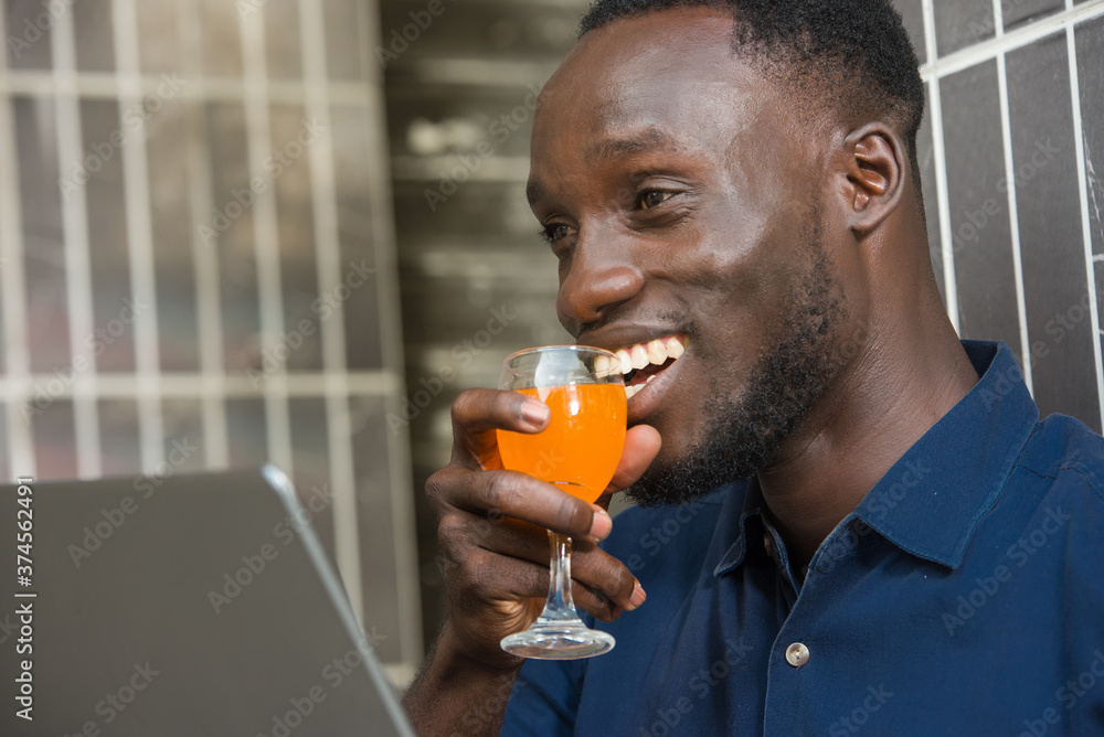 close-up of a happy young man with glass of juice. close-up of a happy young man with glass of juice.