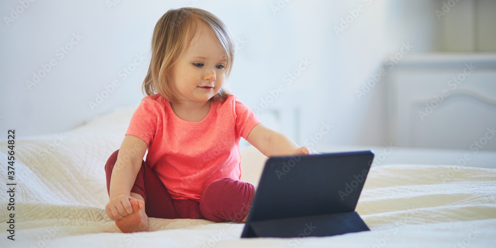 Toddler girl with digital tablet at home Toddler girl with digital tablet at home