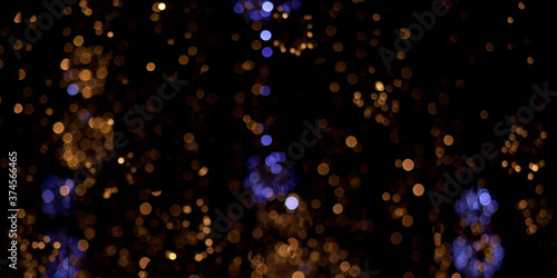 background with golden and purple bokeh on black