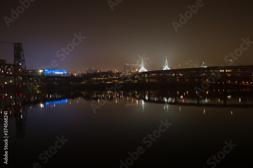 Highway Bridge and Buildings Reflected in Willamette River at Night, Portland, Oregon, USA