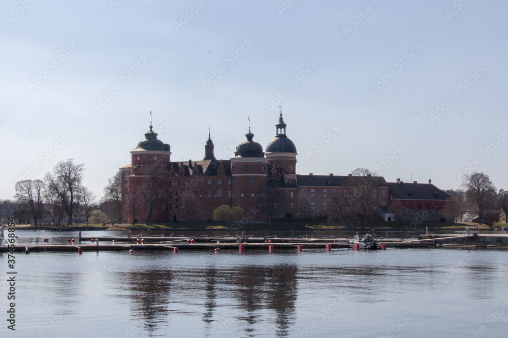Mariefred pier and Gripsholm Castle in a sunny day, Mariefred, Sweden.